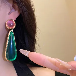Vintage resin waterdrop pendant earrings with golden hammer-textured edges for women