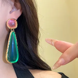 Vintage resin teardrop earrings with pink and green translucent stones in gold finish