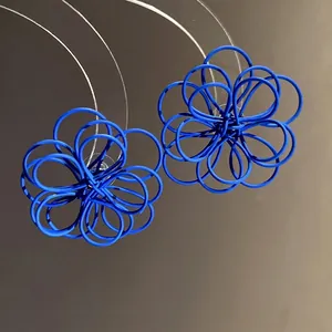 Elegant blue wire-wrapped flower stud earrings featuring a modern minimalist design