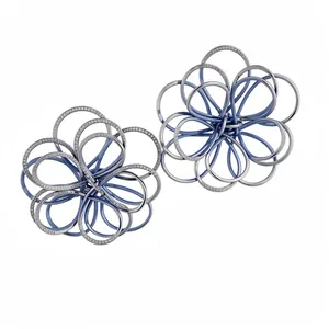 Elegant intertwined floral hollow ear studs with blue and silver painted metal loops.