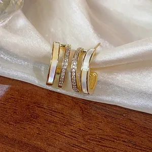 Elegant 14k gold plated C-shaped earrings with mother of pearl inlay and CZ stones