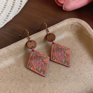 Vintage bohemian pink diamond earrings with floral pattern and wooden accent