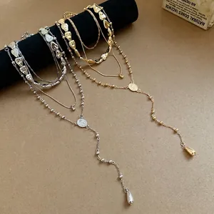 Elegant four-piece set of irregular teardrop pendant necklaces in gold and silver