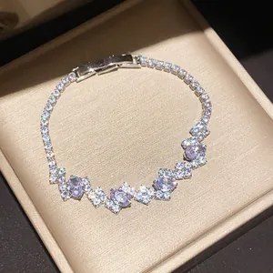 Detail view of a sparkling zircon bracelet in a jewelry box showing fine craftsmanship.