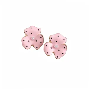 Elegant pink polka dot flower stud earrings with pearl centers and gold finish for women