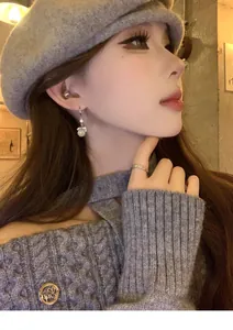 Exquisite rhinestone round resin drop earrings on model for an elegant and chic style