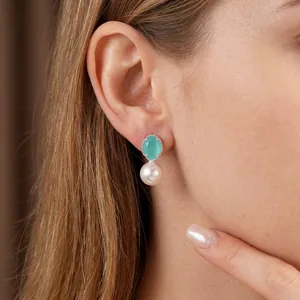 Elegant S925 silver needle stud earrings featuring turquoise stone and white pearl drop