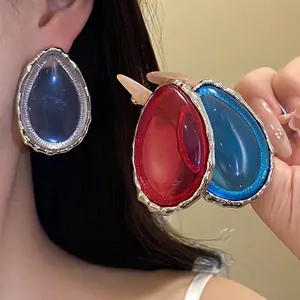 Elegant resin teardrop earrings in multiple colors featuring silver irregular edges.