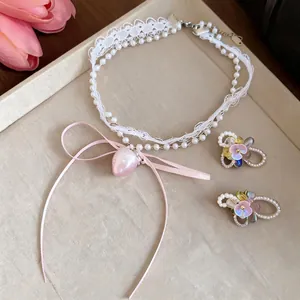 Sweet lace and pearl choker set with pink heart pendant and matching floral earrings