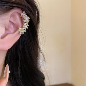 Detailed close-up of 14K gold plated flower zircon ear cuff for non-pierced ears