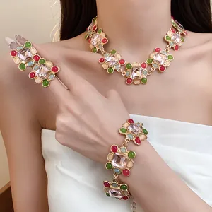Detailed view of French vintage jewelry set with colorful resin stones and gems