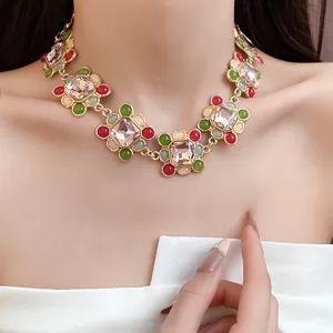 Detailed macro shot of a French vintage geometric necklace with colorful resin stones