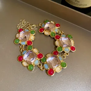 Close-up of vintage French retro bracelet with pink gems and colorful resin beads.