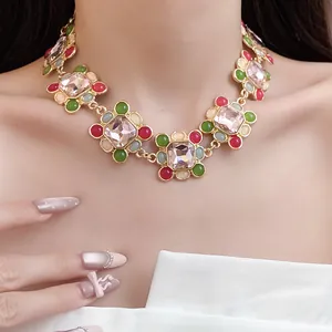 Detail shot of vintage French style necklace with colorful resin and rhinestones