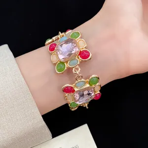 Detailed view of a French vintage resin bracelet with colorful geometric rhinestones.