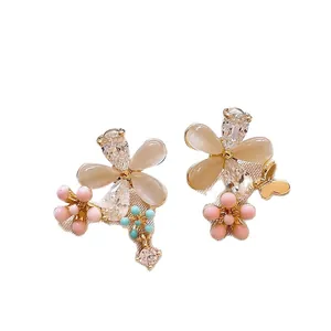 Elegant floral butterfly earrings with cat eye stones and sparkling rhinestones
