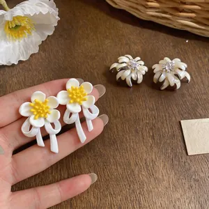 Elegant handmade flower stud earrings featuring oil-drip finish and sparkly rhinestone details