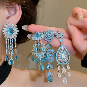Detailed view of exquisite blue zircon flower earrings with sparkling tassels
