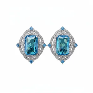 Elegant silver-toned stud earrings with emerald-cut blue zircon and stone accents