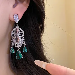 Elegant silver needle drop earrings featuring green zircon waterdrop pendants in a vintage style