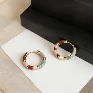 Detailed macro view of 14K gold-plated colorful dopamine enamel patchwork hoop earrings.