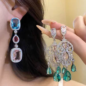 Close-up of vibrant zircon drop earrings featuring multi-colored stones and fine details.