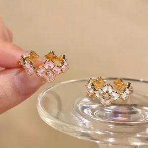 Elegant 18K gold plated flower rings with pink and white enamel and zircon stones.