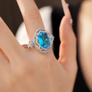 Detailed macro view of a vintage silver ring featuring a large emerald-cut blue zircon stone