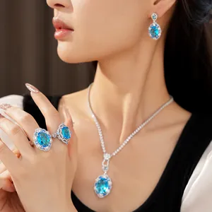 Elegant blue zircon jewelry set including oval necklace, matching earrings and rings.