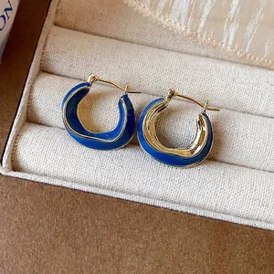 Elegant 14k gold plated irregular hoop earrings with blue enamel finish in box