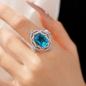 Close-up of a vintage luxury ring with large blue zircon and micro-paved diamonds