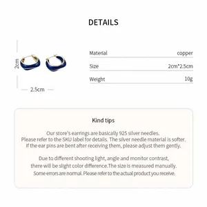Detail showing dimensions and material of blue enamel irregular 14k gold earrings