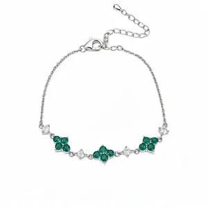 Elegant silver bracelet featuring green zircon flowers and clear crystal accents