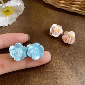 Elegant light blue and peach camellia flower stud earrings for sweet summer outfits