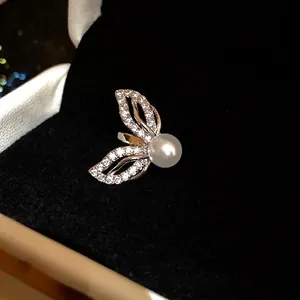 Elegant 18k gold plated butterfly wing ear clip with micro-paved zircons and pearl