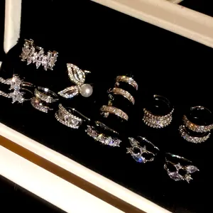 Sparkling 18k gold plated zircon ear cuff set displayed in a luxury black velvet jewelry box