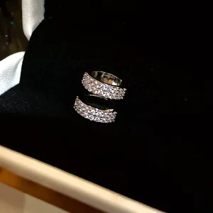 Close-up of an elegant 18k gold plated zircon triple layer ear cuff earring for women