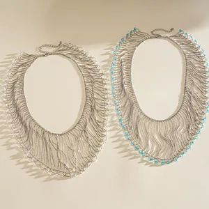 Detail view of crystal bead tassel fringe necklaces in silver and light blue variants.