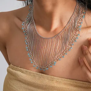 Detailed view of an elegant silver bead fringe necklace featuring light blue crystal beads