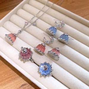 Detailed view of zircon resin pudding pendant necklace, rings, and earrings jewelry set