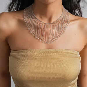 Elegant detail view of a silver fringe lace necklace with crystal beads on a female model