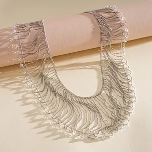 Detailed macro shot of an elegant metallic fringe necklace with shimmering crystal beads