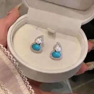 Elegant gourd-shaped silver earrings with turquoise, pearls, and pavé zirconia stones