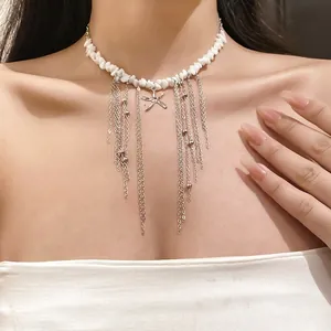 White stone beaded necklace with starfish pendant and long silver chain tassels
