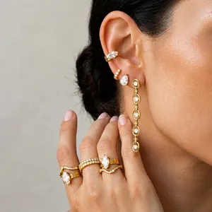 Detailed macro view of gold titanium steel jewelry set with sparkling zircon stones