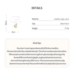 Detail showing dimensions and material specifications of resin pleated pendant necklace.
