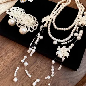 Romantic multi-layer pearl necklace with shell flower charms and tassels