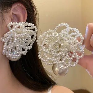 Exquisite elegant oversized pearl cluster floral earrings with a large hanging pearl drop