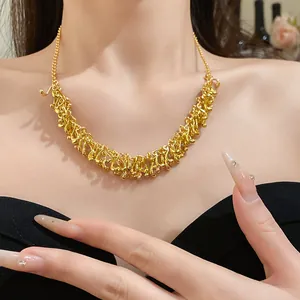 Detailed macro shot of an irregular gold geometric fringe necklace worn by a model