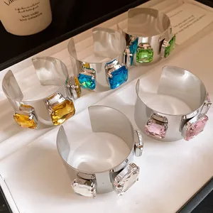Five colors of metallic cuff bracelets with large square-cut colorful gemstones.